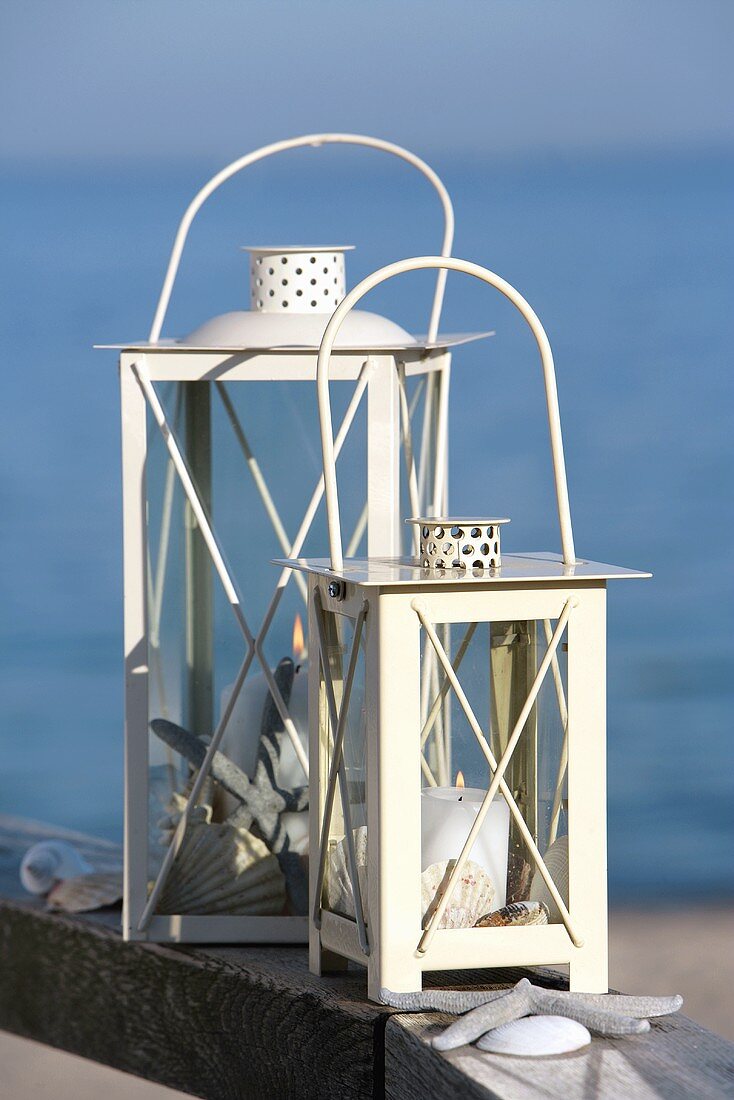 Two white lanterns by the sea