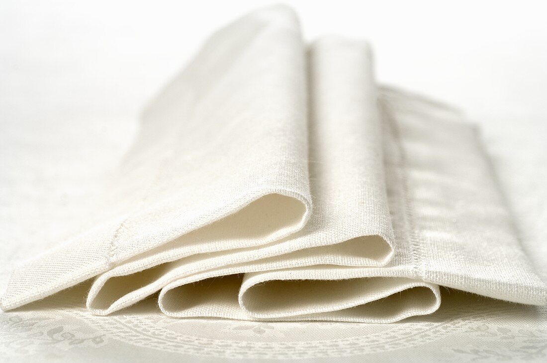 Folded white fabric napkin