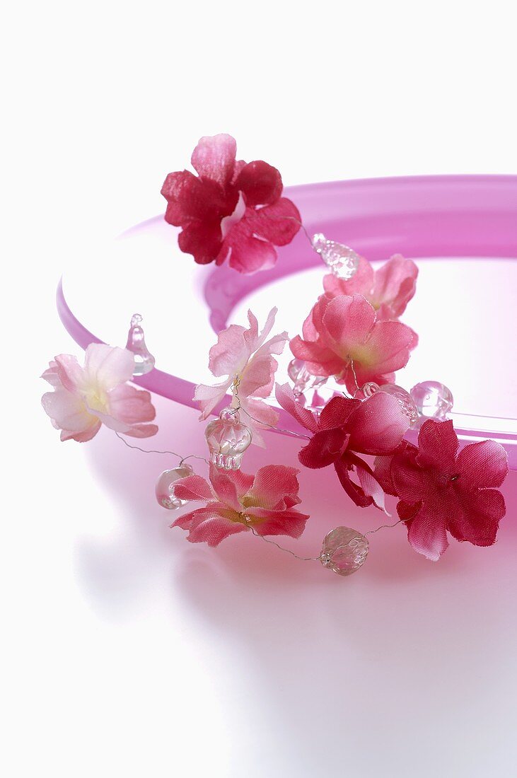 Pink plate with garland of flowers
