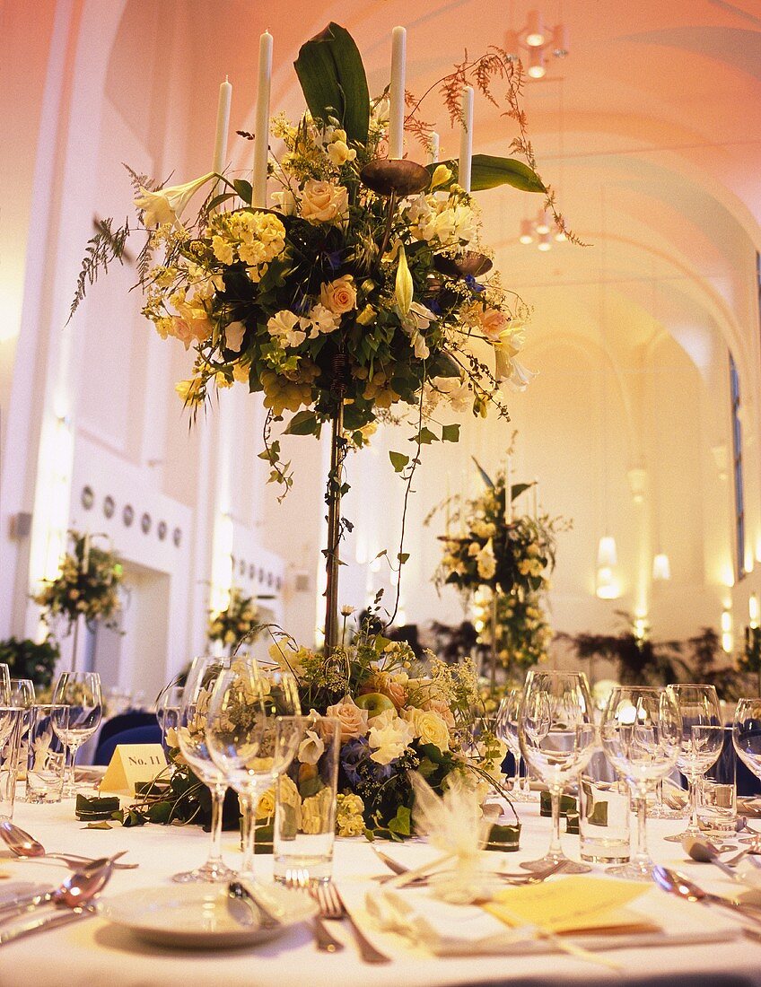 Elegant flower arrangement on table laid for special occasion