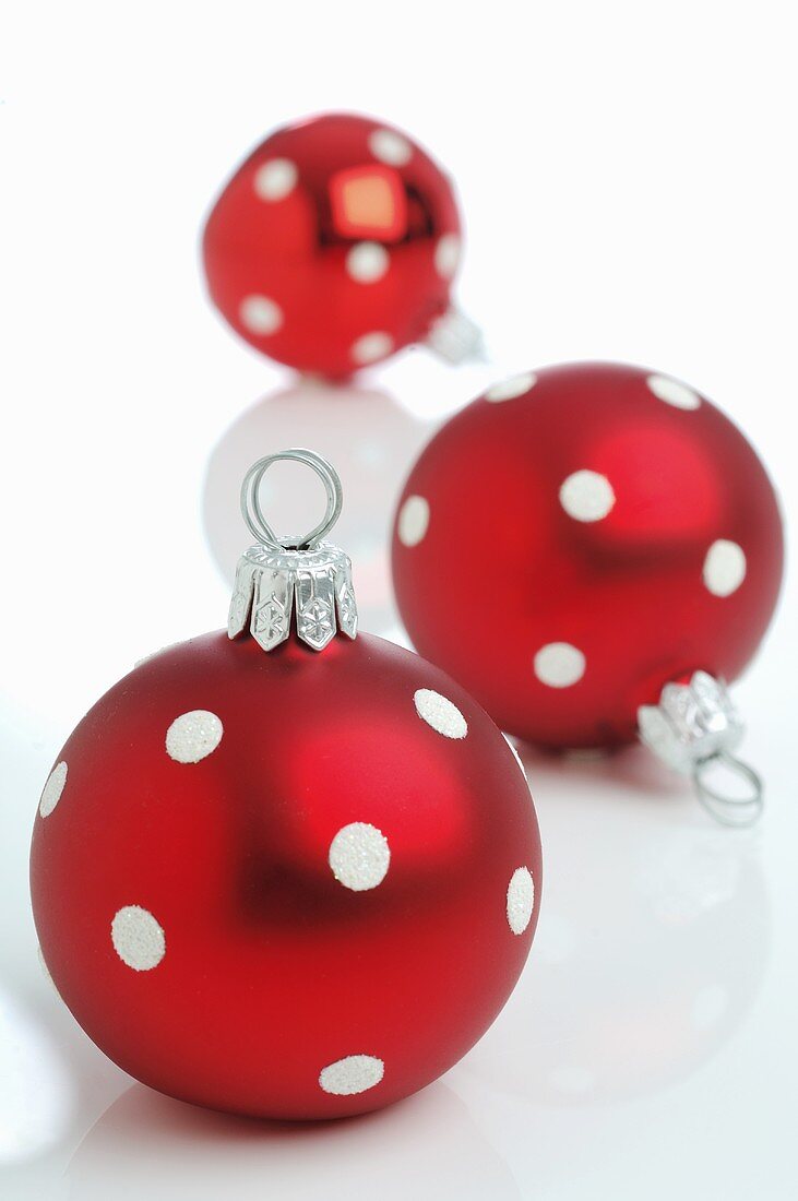 Red Christmas baubles with white spots