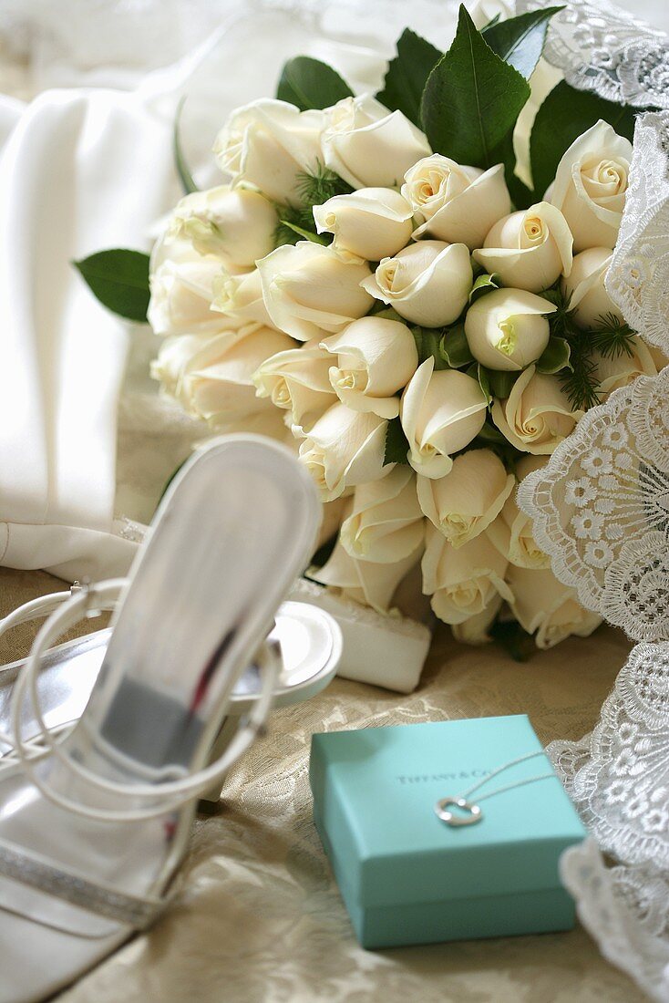 Wedding bouquet of white roses, wedding shoes & jewellery