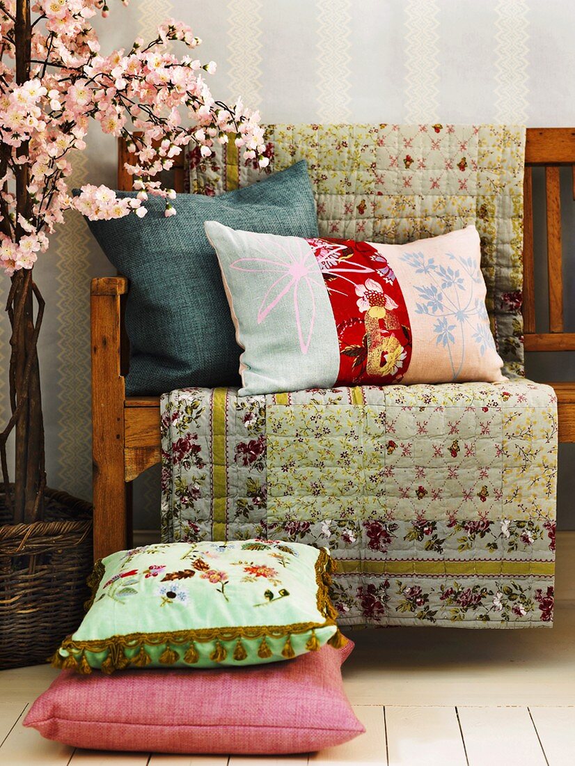Cushions and cover on wooden bench