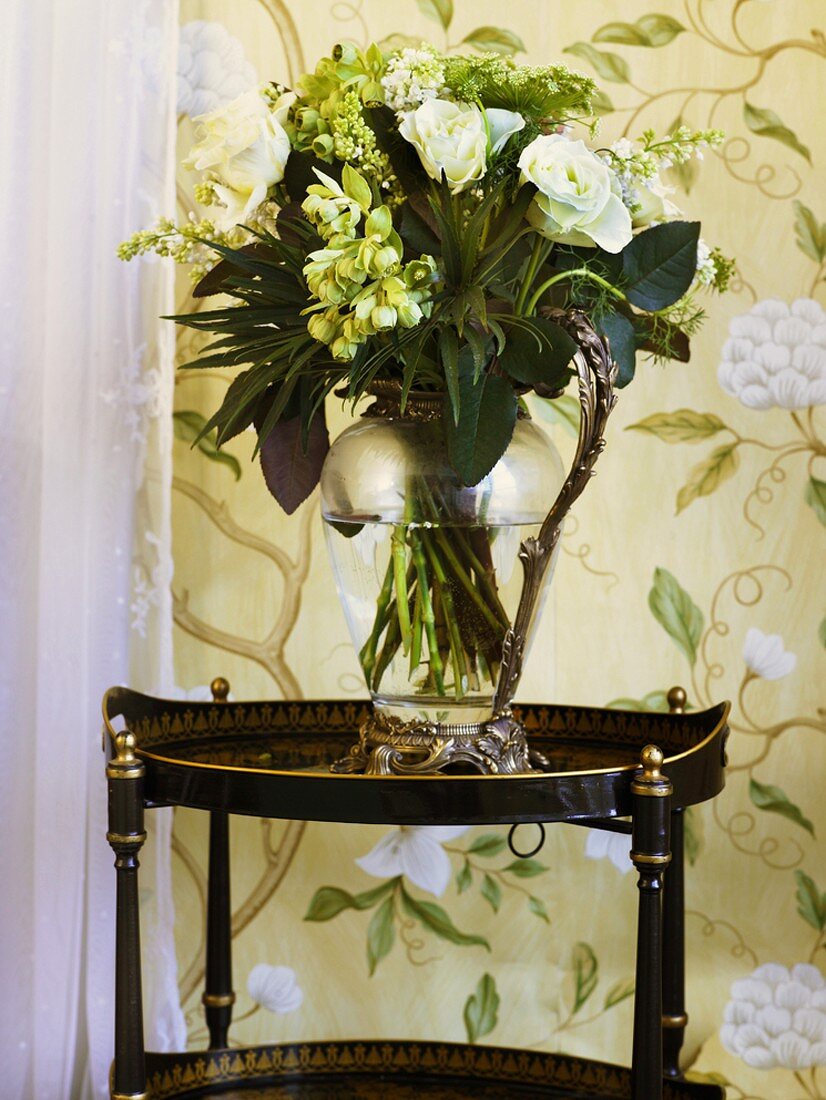 Jug of flowers on side table