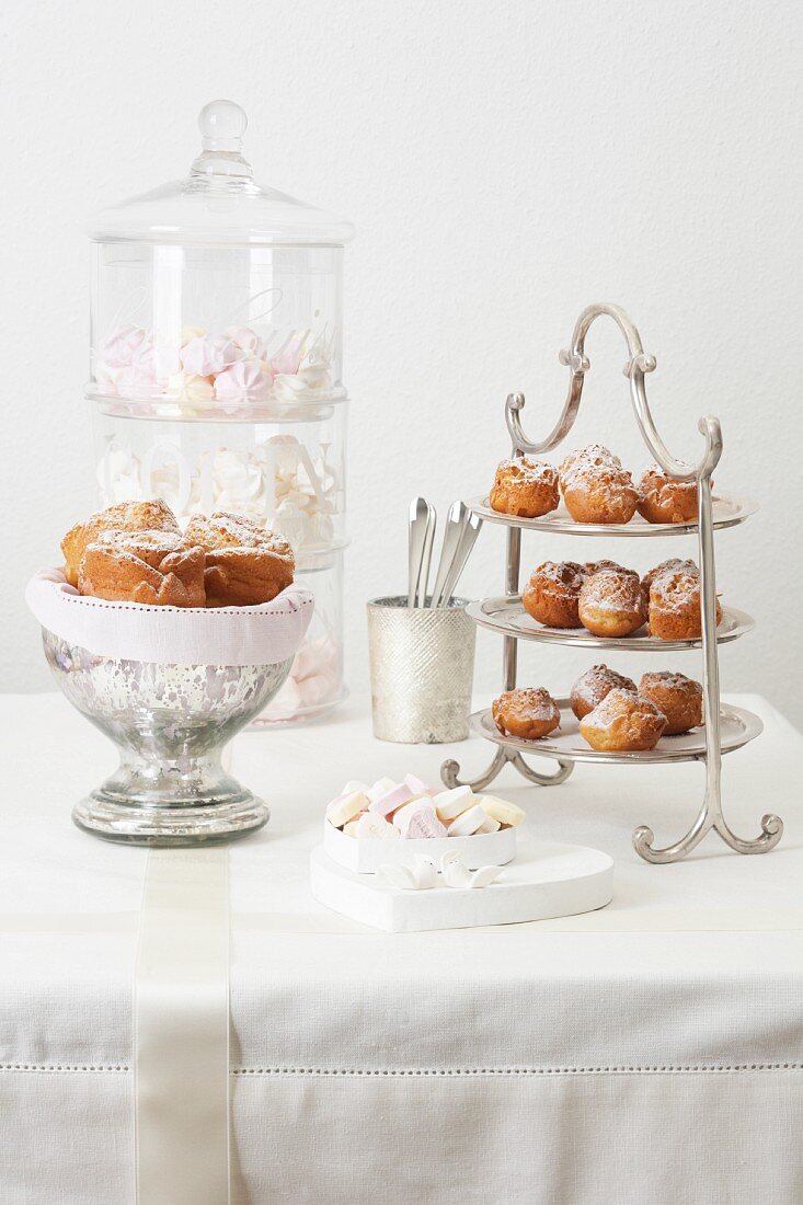 Cakes and sweets on a white wedding table