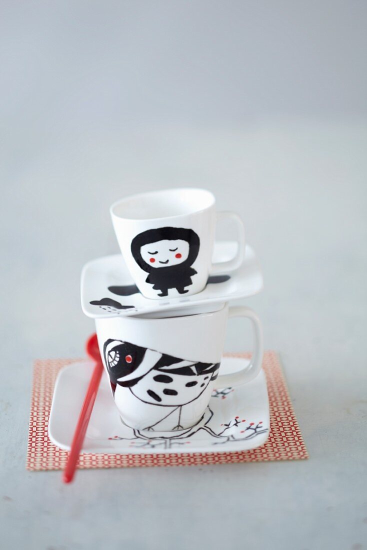 A hand-painted coffee and espresso cup