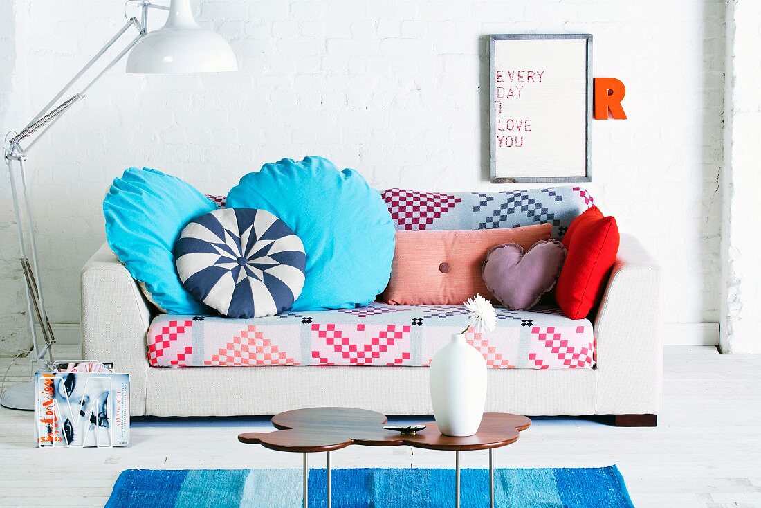 Sofa with colourful upholstery and scatter cushions
