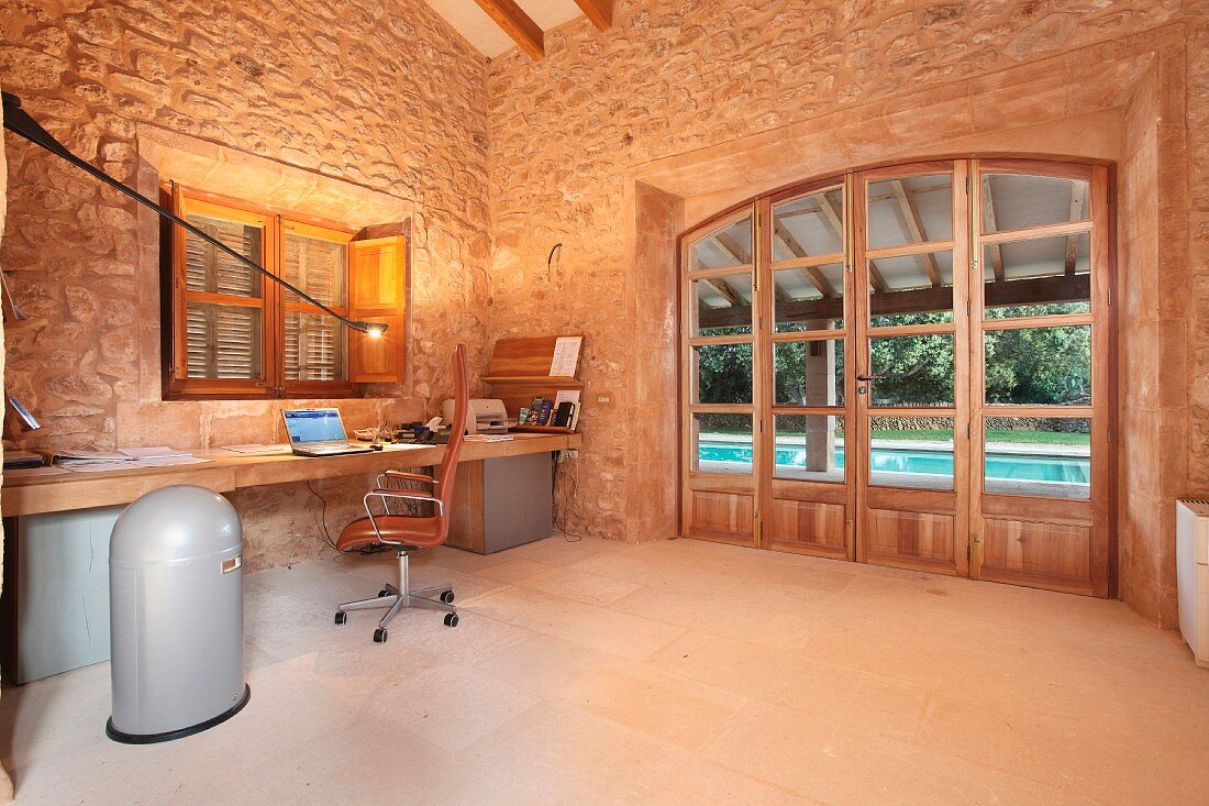 Home office with stone walls