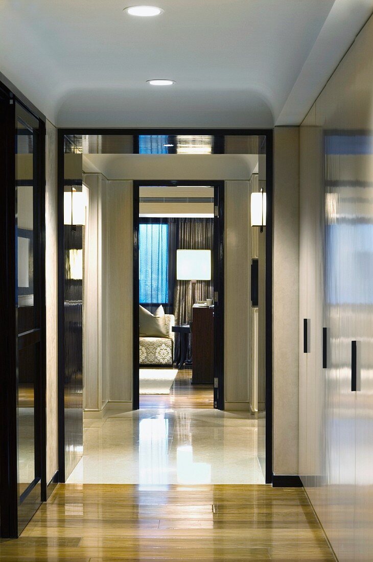 Elegant lobby with view through an open door onto floor lamps