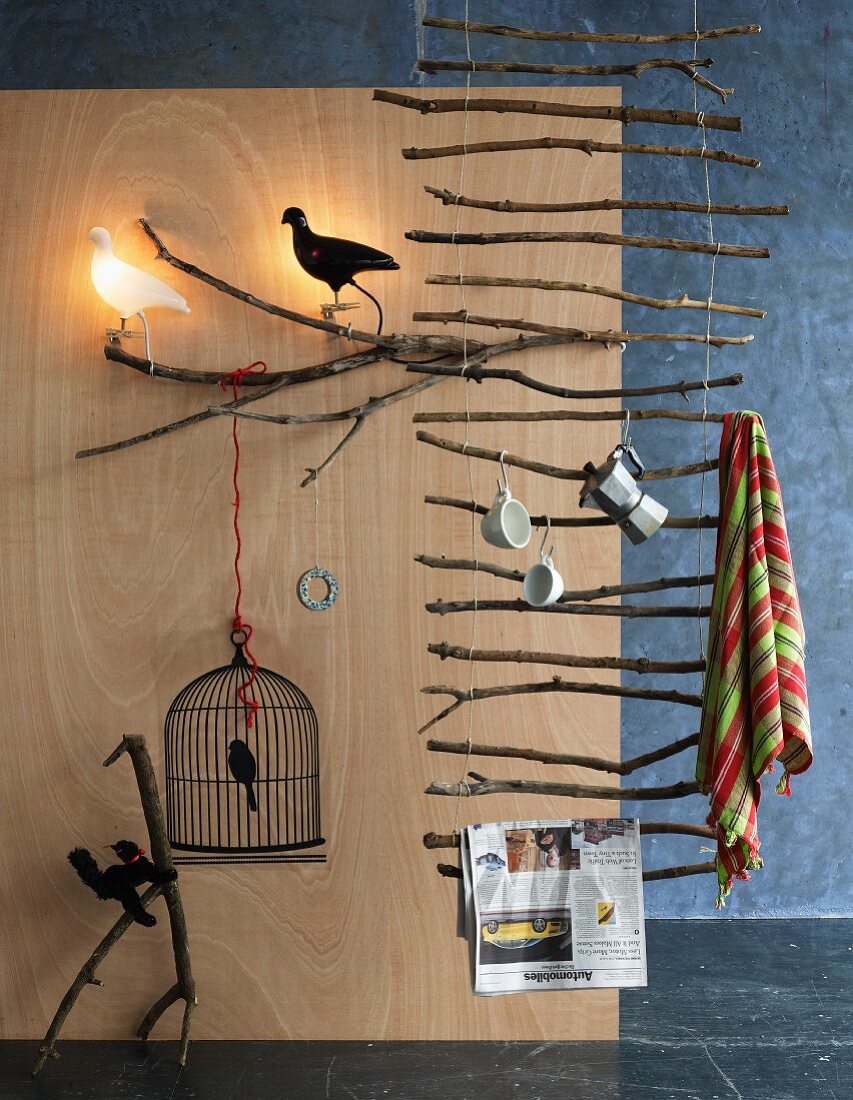 Ladder-like suspended rack made of branches & various ornaments with bird motifs