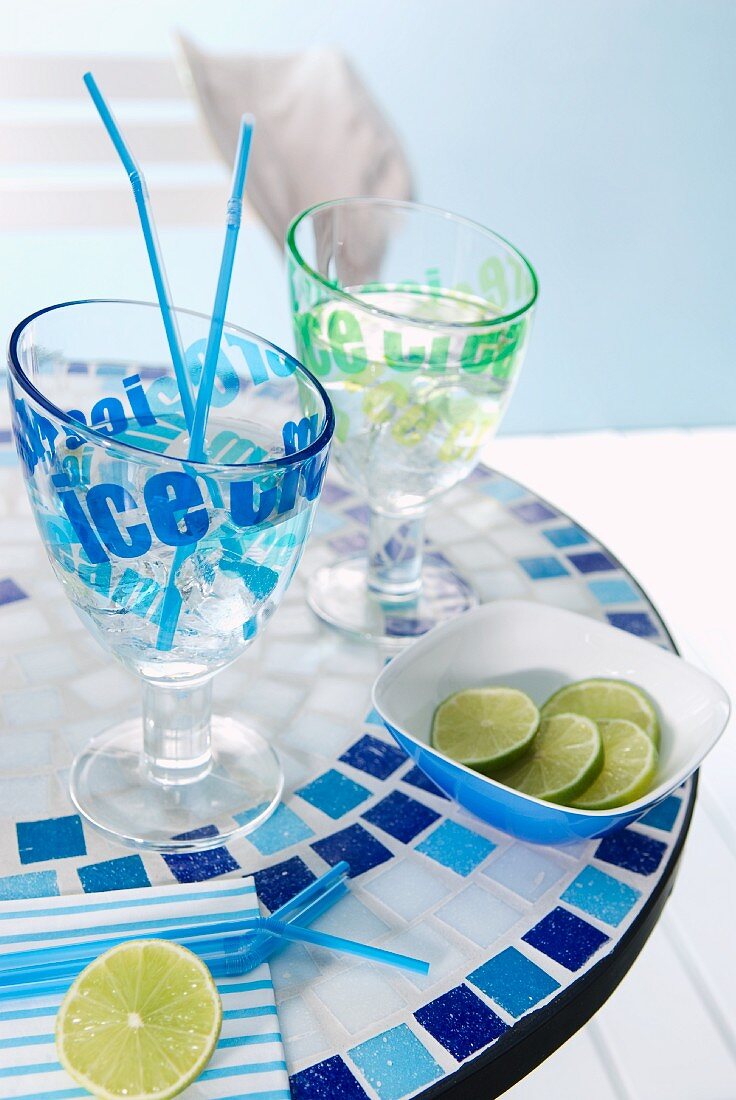 Printed cocktail glasses and dish on mosaic table