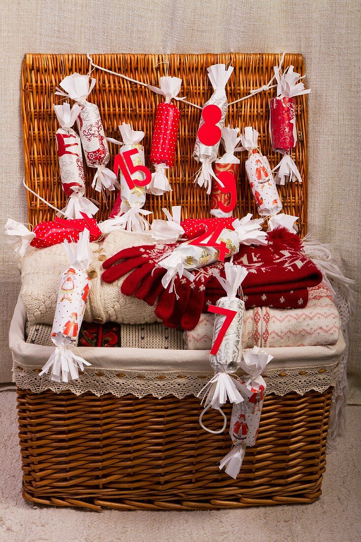 Basket containing winter clothing and an advent calendar