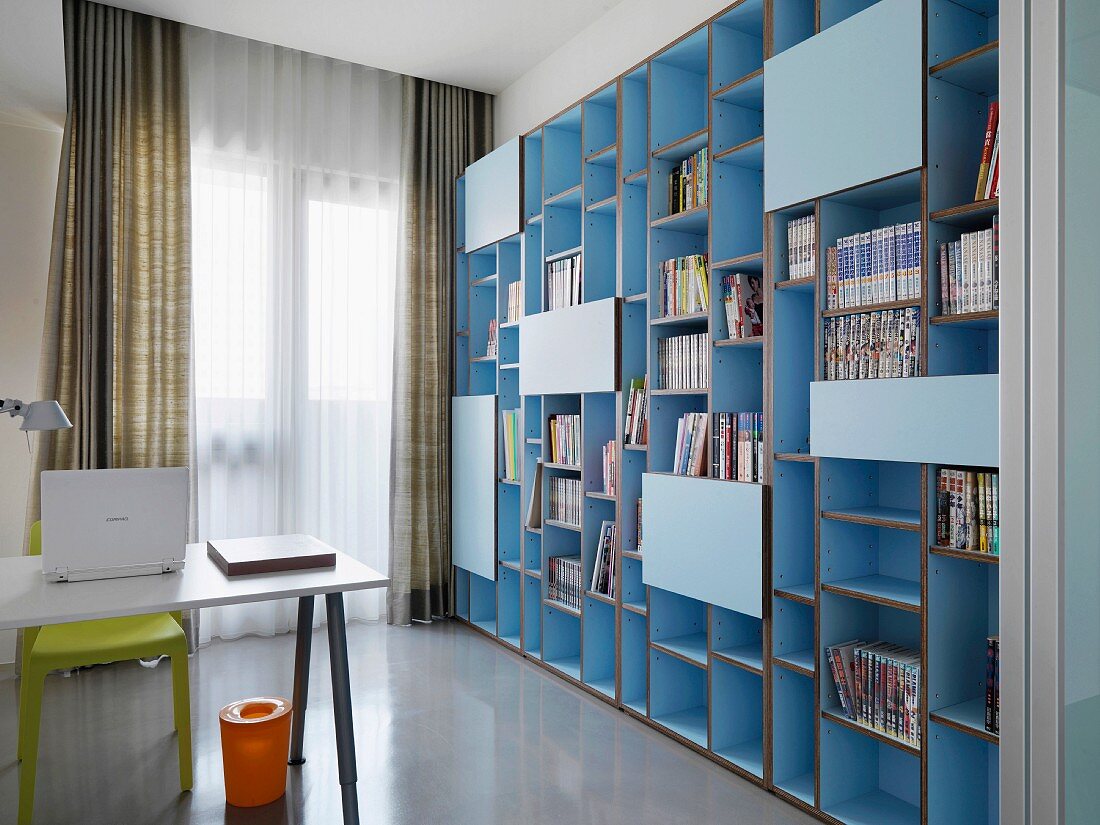 Large bookcase in minimalistic home office