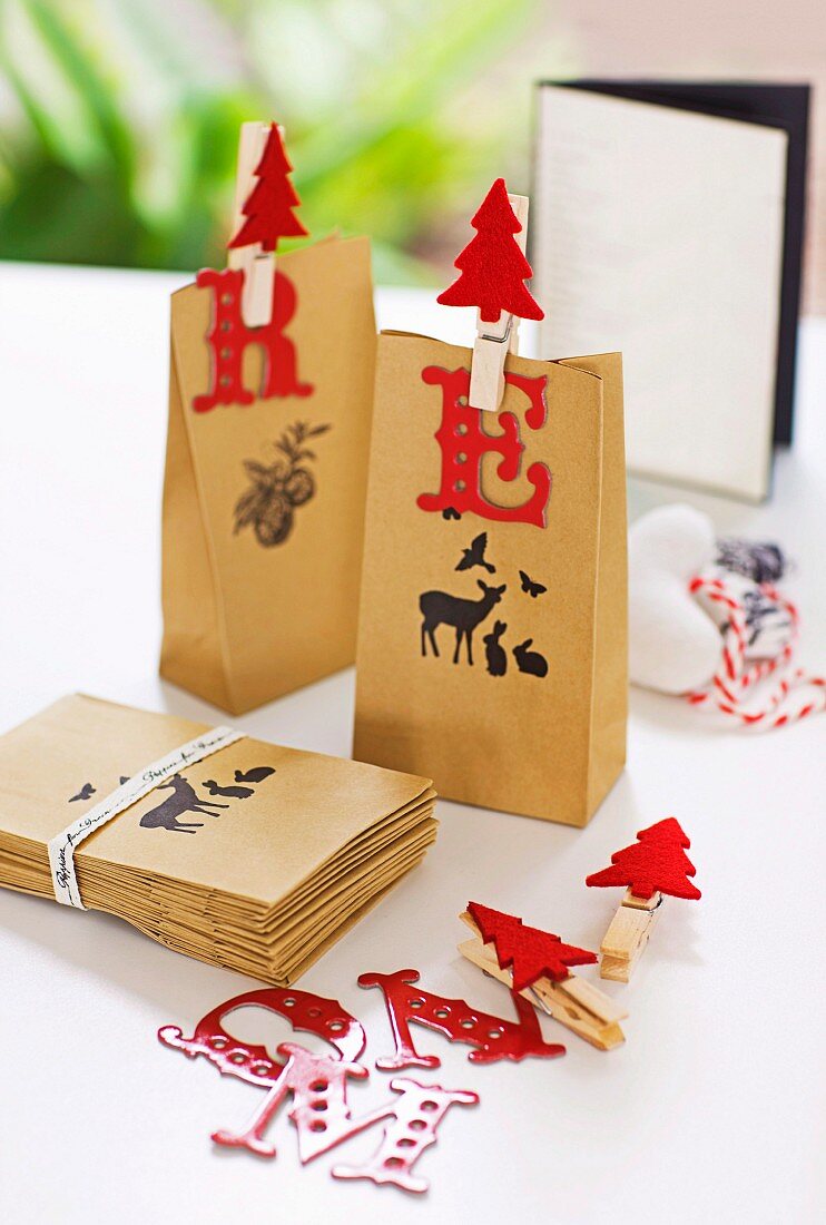 Two paper bags with pictures and Christmas decorations