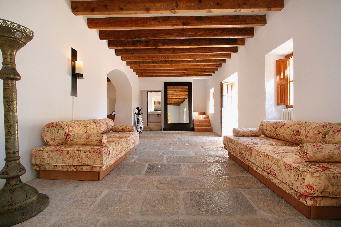 Entrance hall with stone tile and wooden ceiling beams