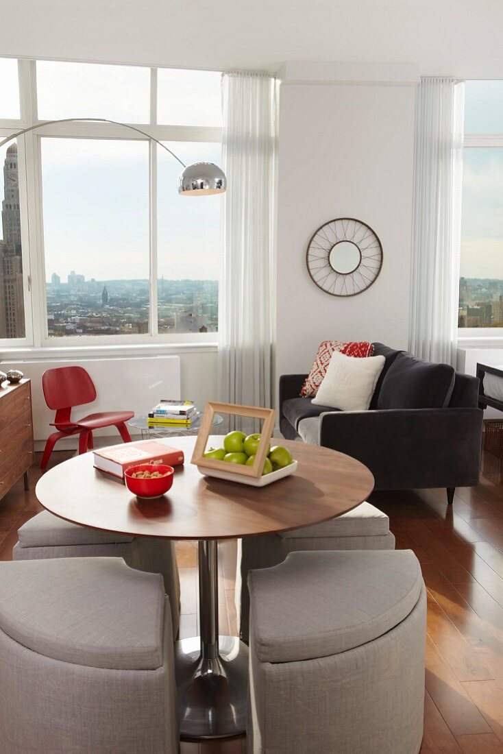 Dining Table and Living Area in a Studio Apartment with City Views