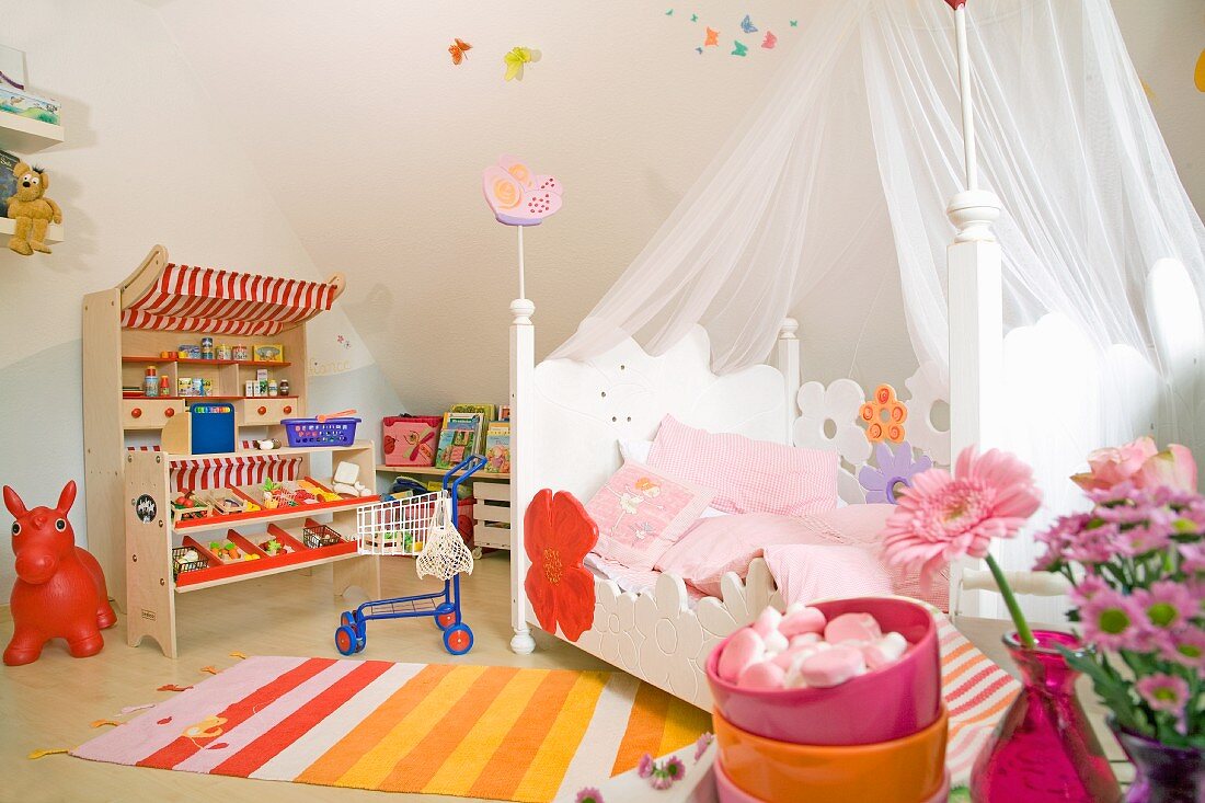 Bed with curtains in a children's bedroom