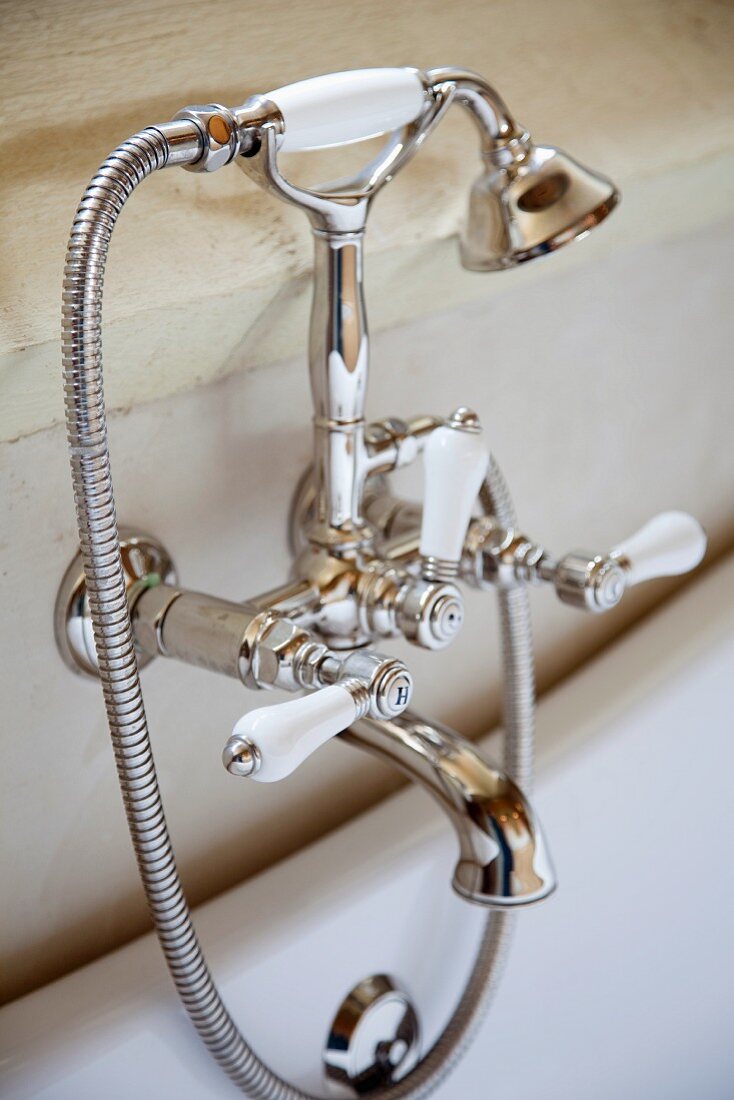 Chrome bath tub fittings with vintage style, white handles
