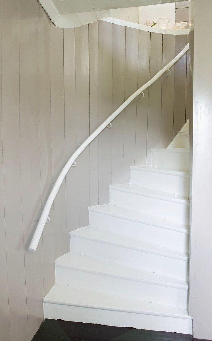 White staircase in wooden house