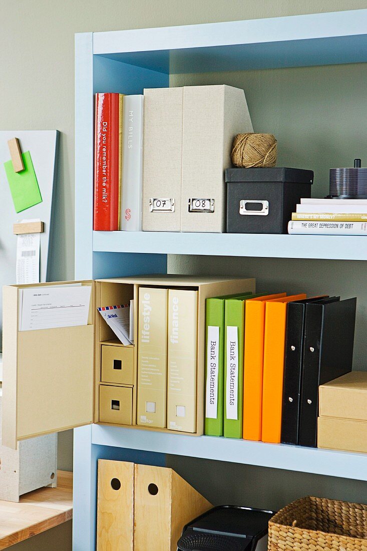 Colourful folders and box files on shelving
