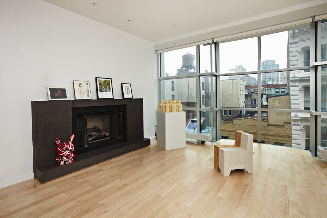 Fire Place in a Living Room; Windows with City Views