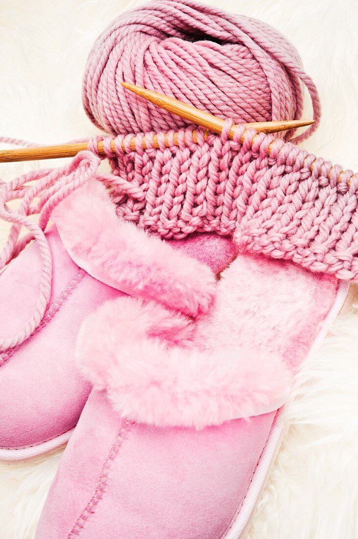 Knitting things and pink house slippers
