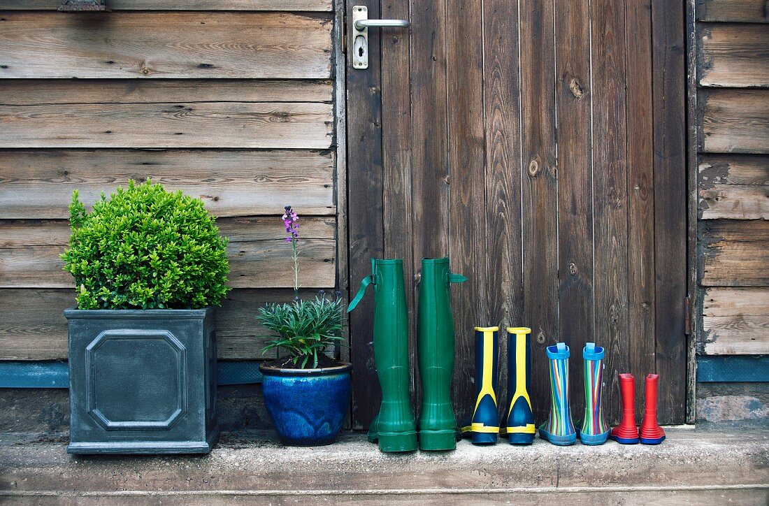 Wellington boots and plant pots by the front door