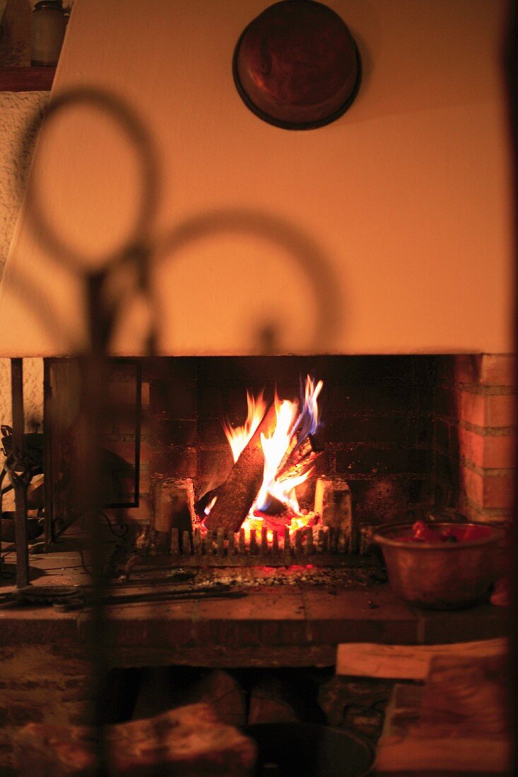 A atmospheric fire in an old brick fireplace