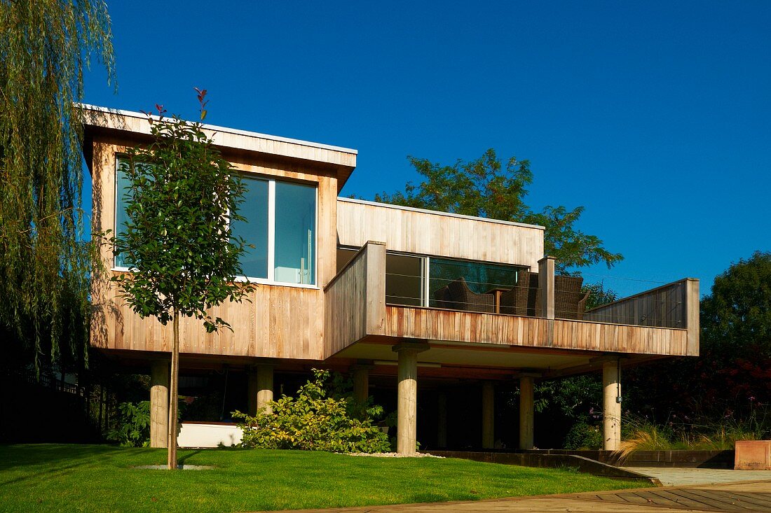 Contemporary wooden house with large windows