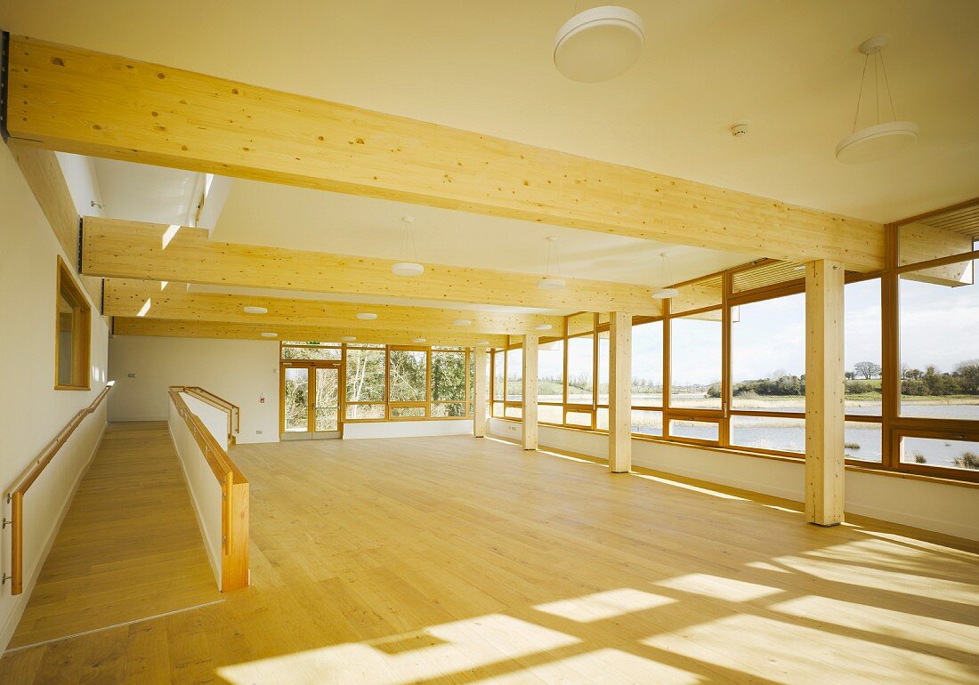 Spacious hall with wooden beams and ramp