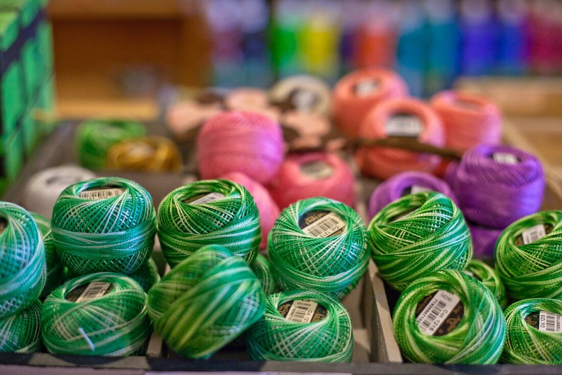 Balls of various yarns in craft shop
