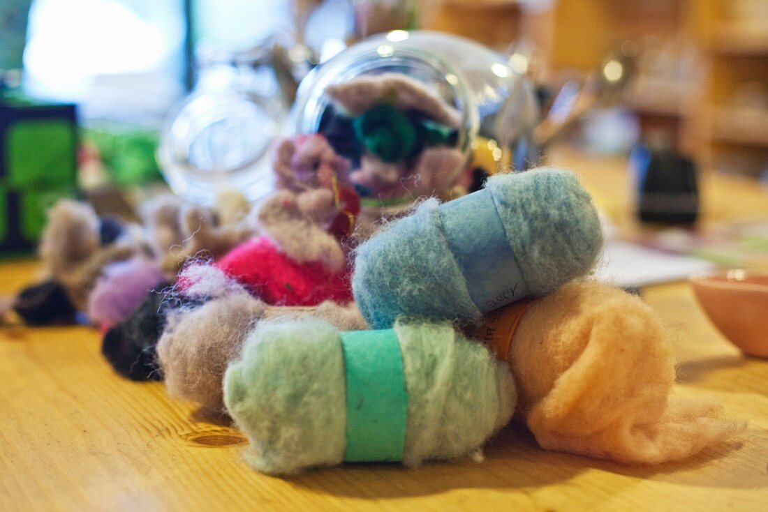 Various balls of felt in craft shop