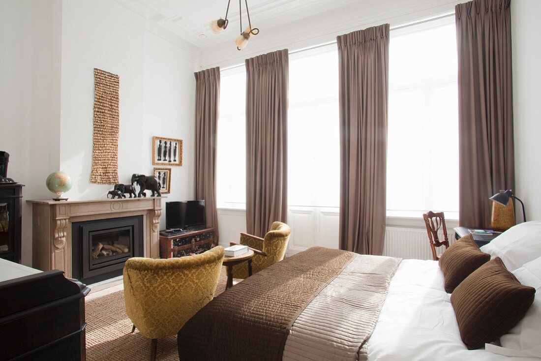 Bedroom in shades of brown with fireplace