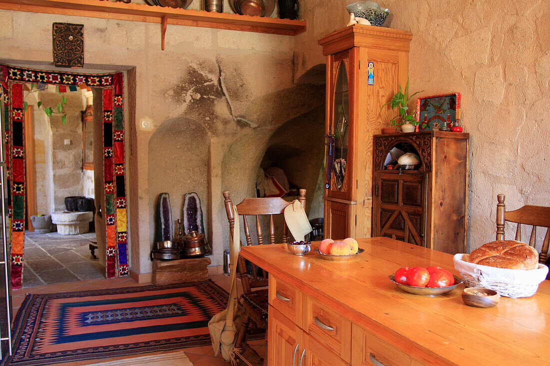 Kitchen with wooden furniture in a cave dwelling