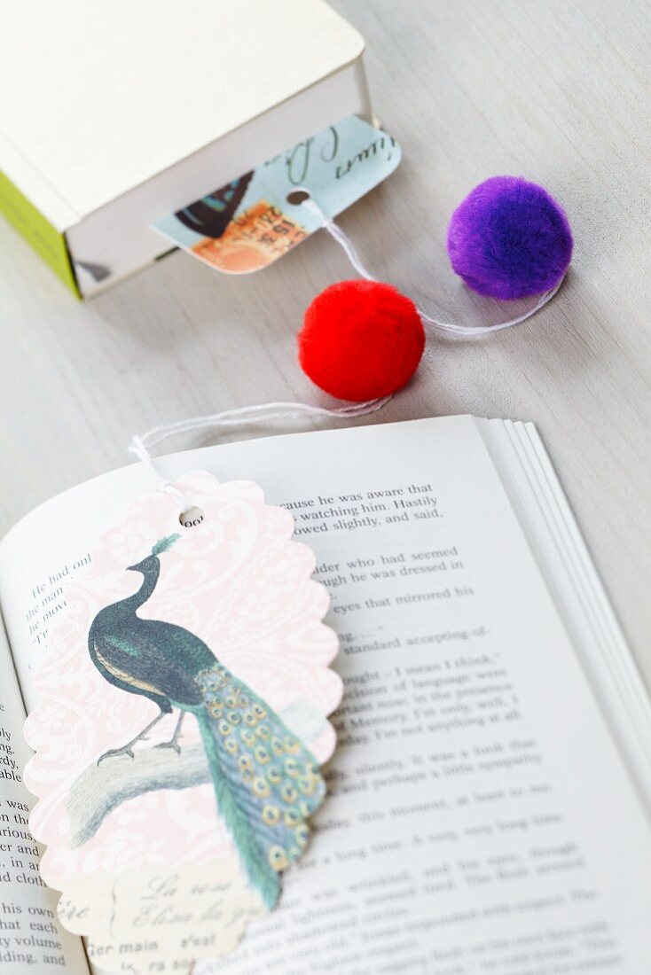 Bookmark decorated with pompoms