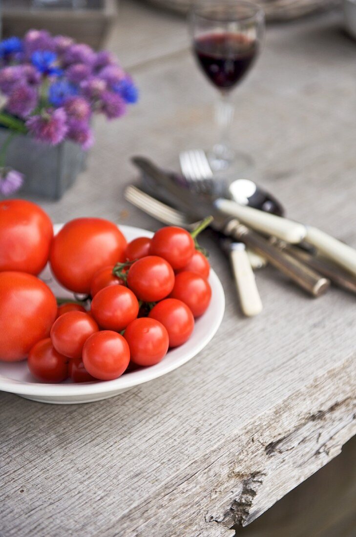 Fresh tomatoes on a wooden table