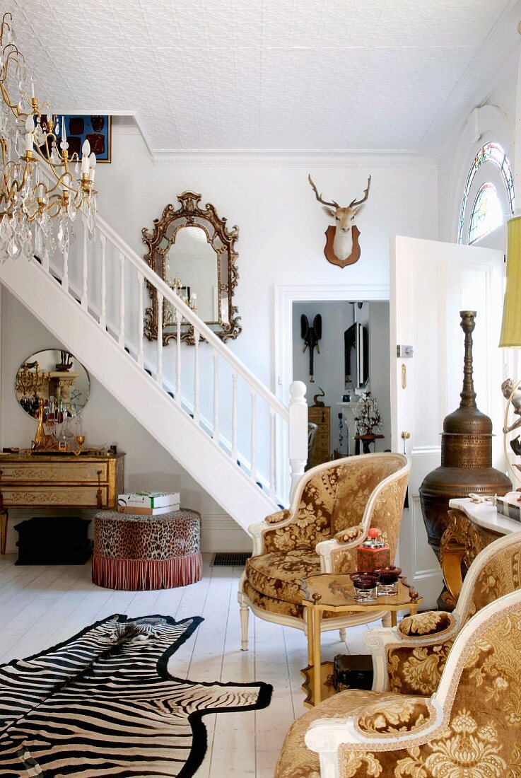 Foyer in English country-house-style with collection of traditional and bizarre accessories