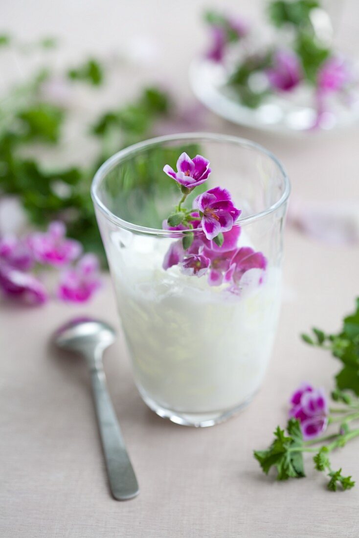 Coconut drink with scented geranium oil & pelargonium flowers