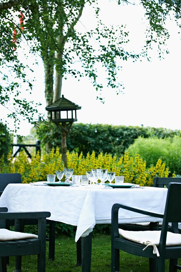 A table laid in a garden