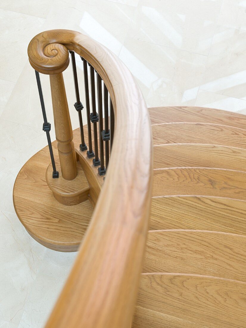 Solid oak staircase with curved bannister rail, spiral newel post and wrought iron balusters