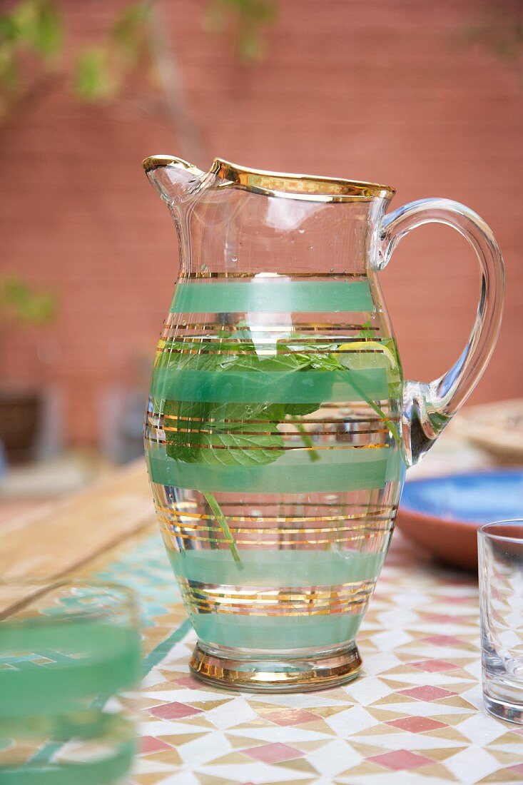Glass jug of peppermint tea