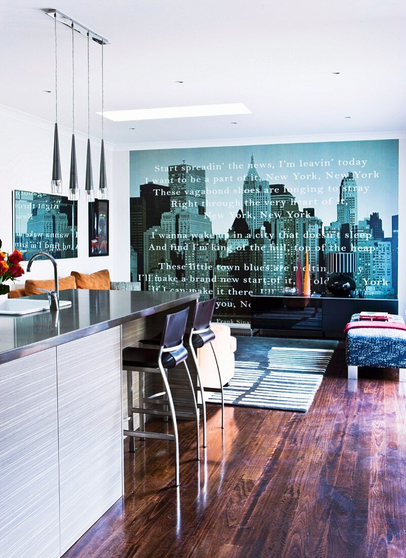 Large photo wallpaper element with cityscape motif in modern interior with rustic wooden floor
