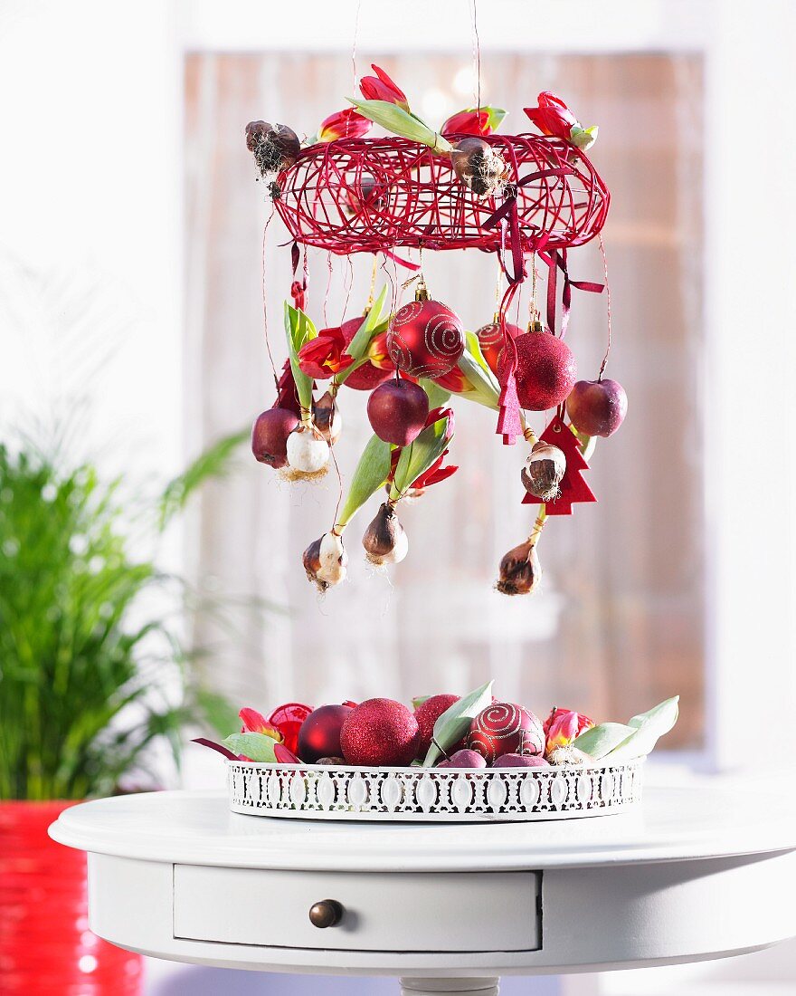 Christmas mobile with red tulips, apples and baubles