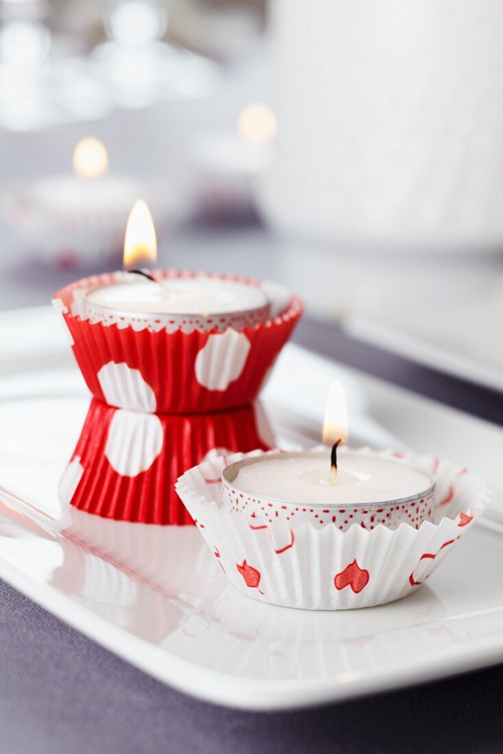Candle arrangement; paper cake cases used as tealight holders