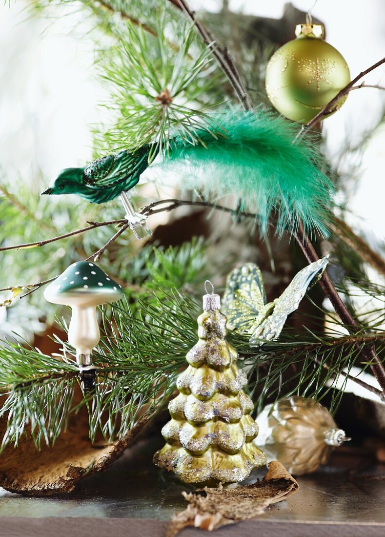 Various baubles hanging on fir branches