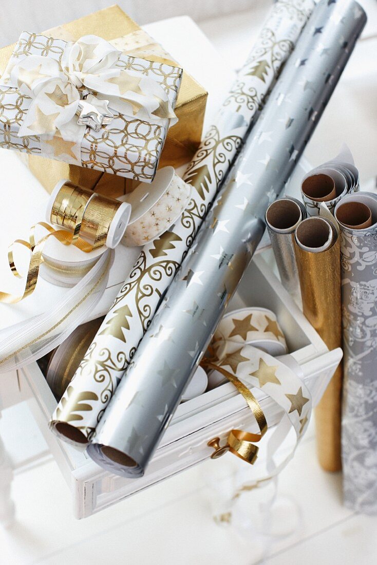 Rolls of festive wrapping paper and ribbons
