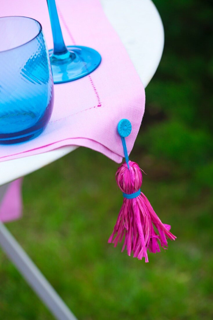 Tablecloth with homemade tassel on a patio table