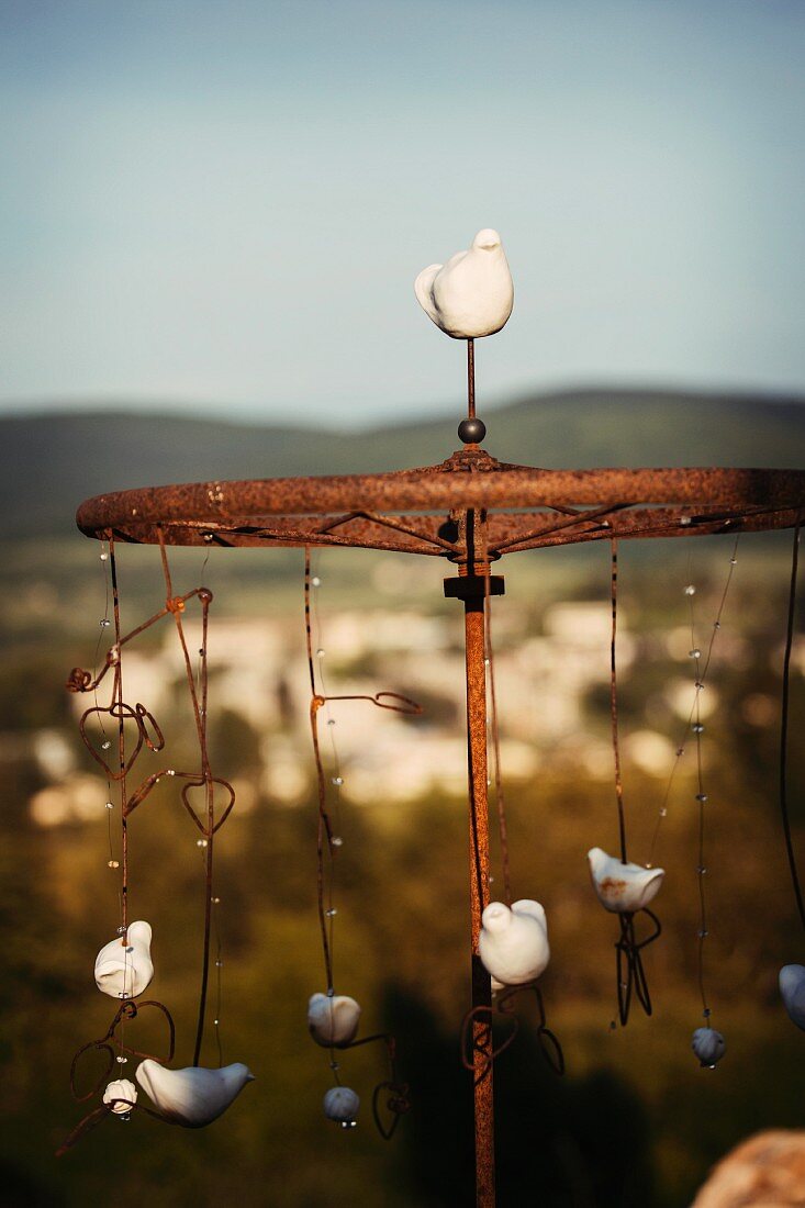 Mobile with bird figurines as garden accessory