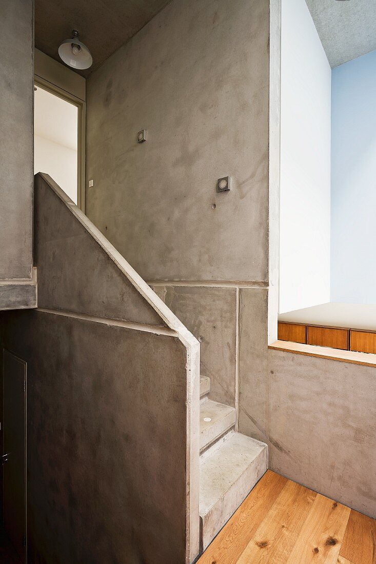 Concrete and pale wood stairwell