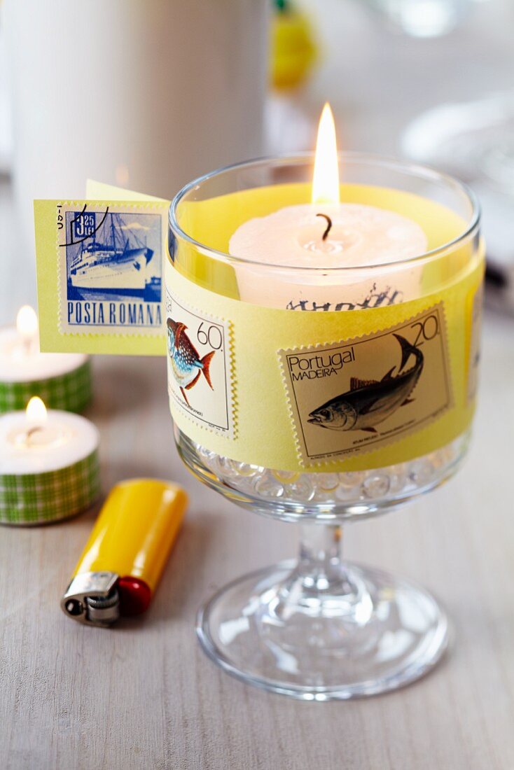 Candle lantern decorated with postage stamps